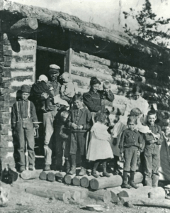Figure 10. The John Robert and Luna Ardell Paul family at their homestead at Cedron, Idaho, ca. 1899. Two additional girls were born after this picture was taken. Lynn Paul is the small child wearing dark clothes in the right arm of his father.